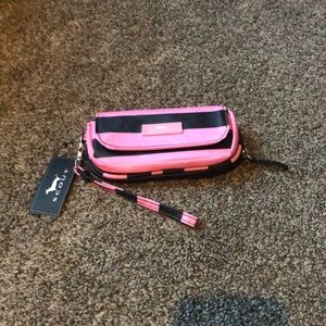 New with tags Scout wallet/wristlet. It is pink and black in color.